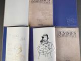 four books of feminists and resistance on a table