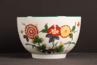 a white bowl with a colorful flower design on it