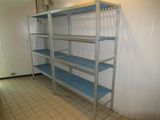 a metal shelving with blue shelves in a room
