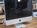 a computer monitor sitting on top of a wooden desk