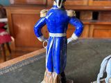 a figurine of a man and a dog on a table