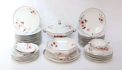 a lot of plates and bowls with flowers on them