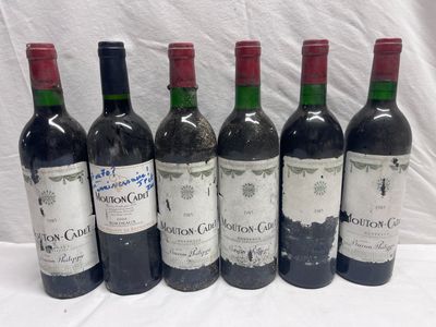 six bottles of red wine are lined up on a table