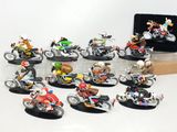 many figurines of people riding motorcycles on a table