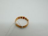 a close up of a ring on a white surface with a string