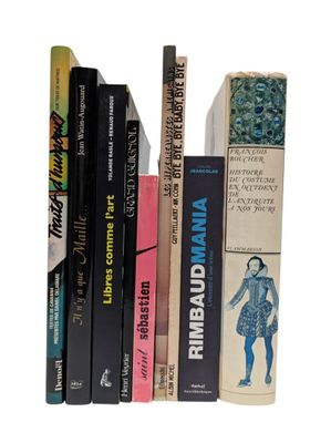 many books that are stacked on top of each other