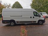 a white van that is parked in a parking lot