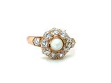 an image of a pearl and diamond ring on a white background