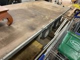 a table that is sitting on a cart in a garage
