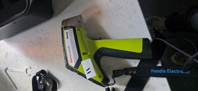 a picture of a cordless stapler and a stapler on a counter