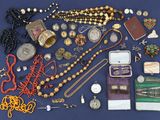 a lot of jewelry on a blue surface