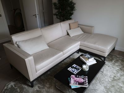 a white couch and a coffee table in a living room