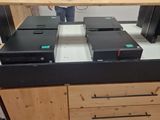 a desk with a bunch of electronic equipment on it