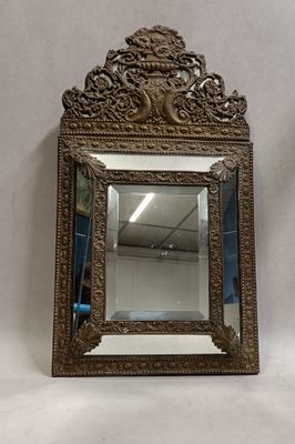 an antique mirror with a gold frame on a white background