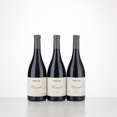 three bottles of wine sitting on top of a table next to each other