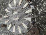 a plastic bag with toothbrushes in it on the floor