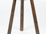 an image of a small wooden stool on a white background