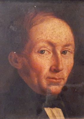 portrait of a man in a black suit and tie holding a piece of paper