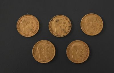 four gold sovereigns, one of which is a sovereign and the other of which is a sovereign