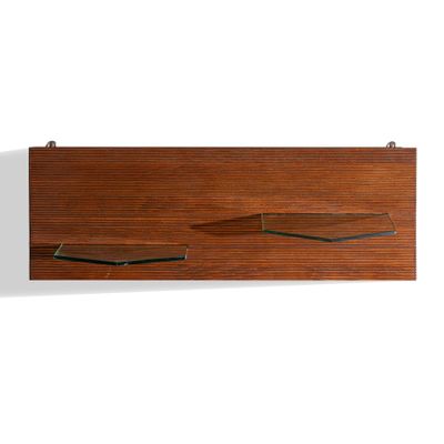 the wall shelf has two shelves on each side of it