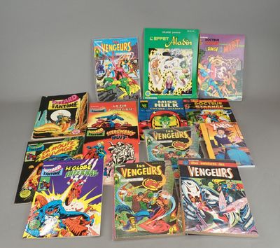 the avengers comic books are lined up on a gray surface