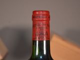 a bottle of wine that is sitting on a table