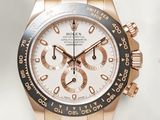 rolex watch with rose gold bezel and black rubber strap