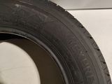 a close up of a tire on a white surface