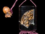 a picture of a butterfly in a glass case on a string