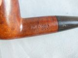 a pipe that is sitting on a white surface