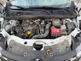 the engine of a car with its hood open and the hood up