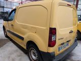 a yellow van that is parked in a garage