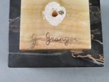 a picture of a wooden plaque with a heart on it