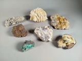 many different types of rocks and minerals on the table