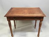 a small wooden table with a drawer on top of it
