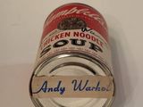 a tin of chicken noodle soup on a table