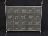 a mesh screen with animals on it on a black background