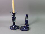 pair of blue and white candlesticks with a star of david design