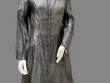 an image of a mannequin dressed in a black dress