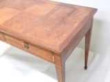 a small wooden table with a drawer on top of it