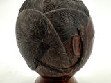 an image of a sculpture of an elephant on a wooden stand