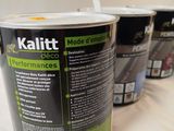 three buckets of paint sitting on top of a table