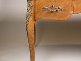 a small wooden table with a drawer on top of it
