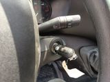 steering wheel of a car with a key in it and a key in the center of the steering wheel