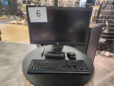 a computer on a table with a keyboard and mouse