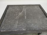 a black table with a black top and a white background