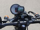 a close up of a motorcycle with a speedometer on it ' s handlebars