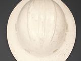 a white hard hat on a black background