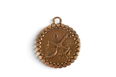 an image of a gold medal with a bird on it