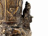 a bronze vase with a man and a woman on it